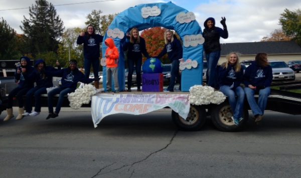 Students on a homecoming parade float.